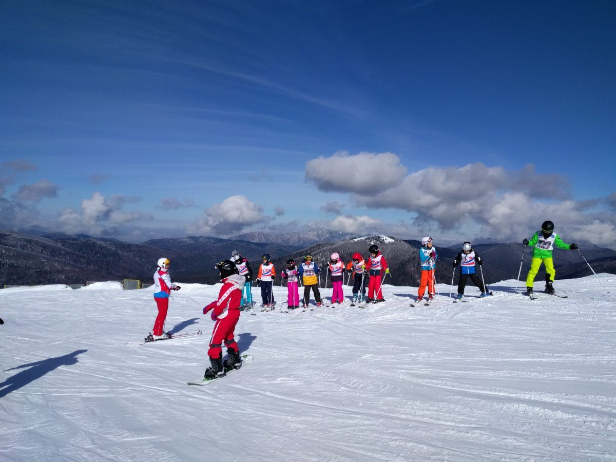 Skiers near Sorica cable car terminal